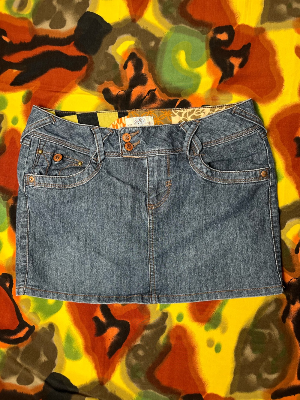 Y2K blue denim wear it declare it mini skirt with brown buttons and pockets